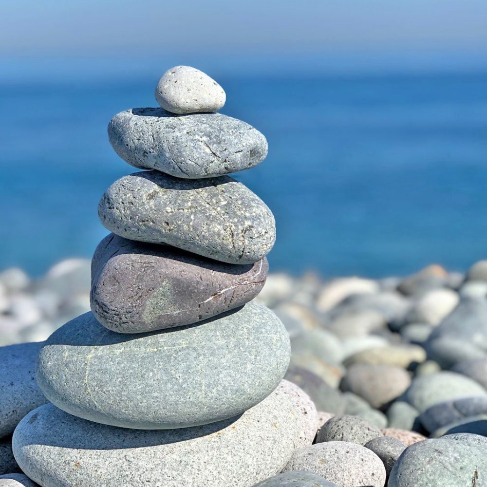 Pebbles stacked on a beach.